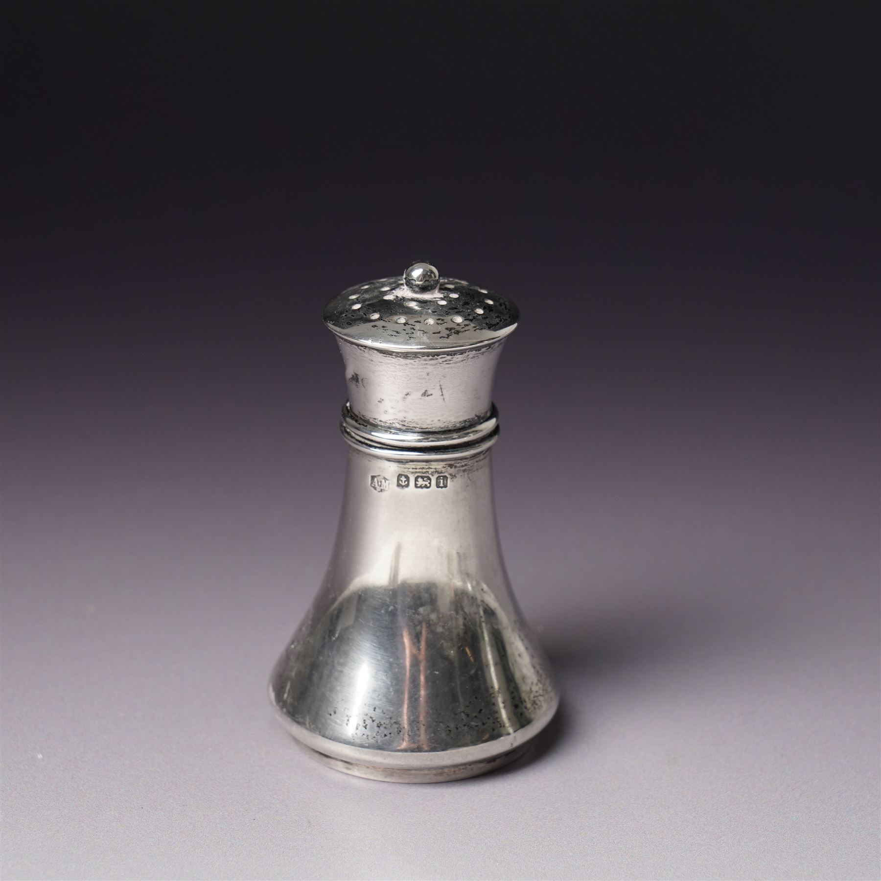 Pair of engraved silver napkin rings London 1912, two 19th century fiddle pattern dessert spoons, four condiment and teaspoons and a silver pepperette