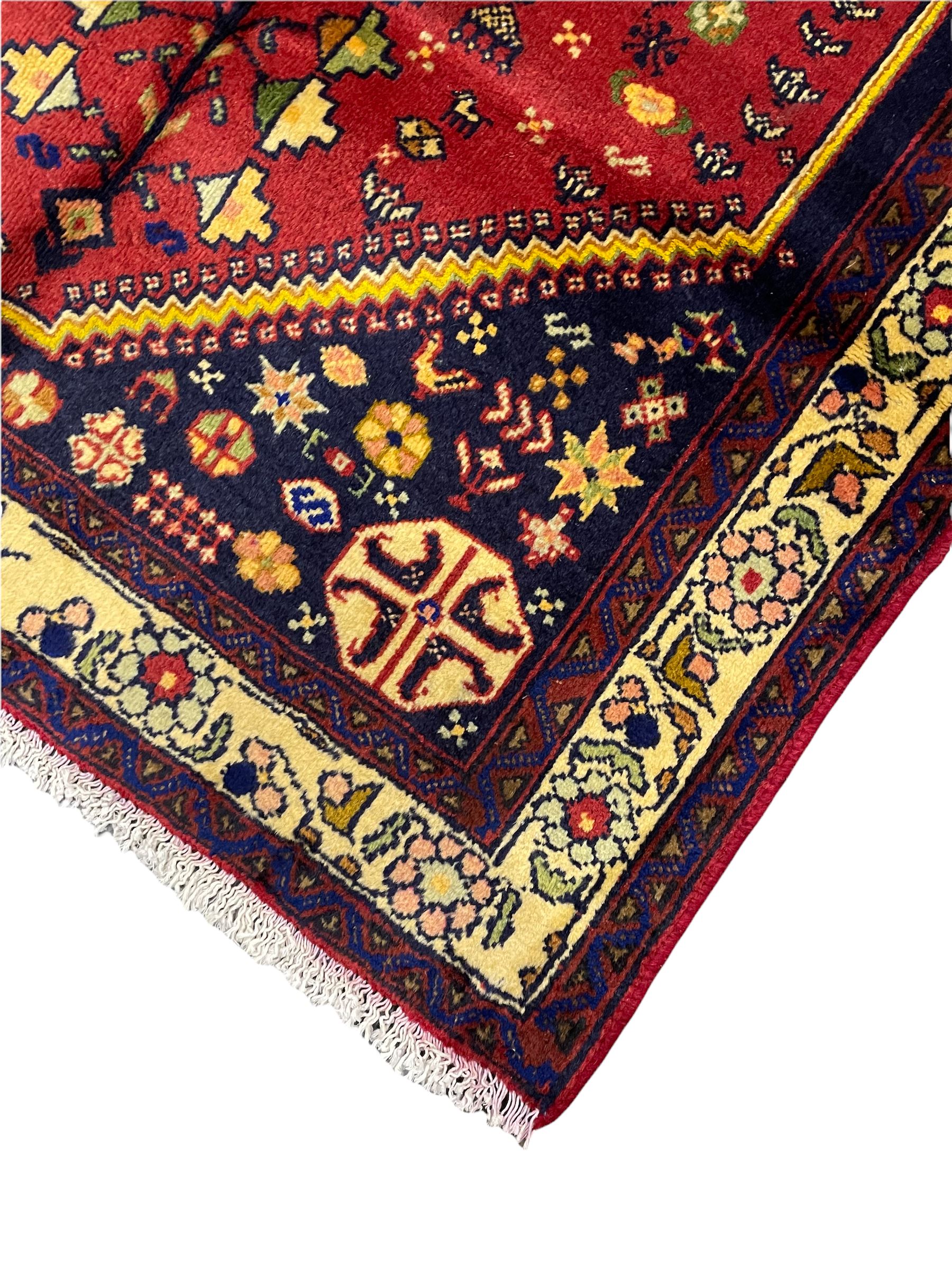 Small Persian Abadeh rug, blue ground with red lozenge field decorated with small bird and plant motifs, triple band border with floral design