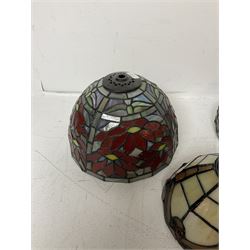Three Tiffany style lamp shades, each with multicoloured floral decoration, largest D20.5cm