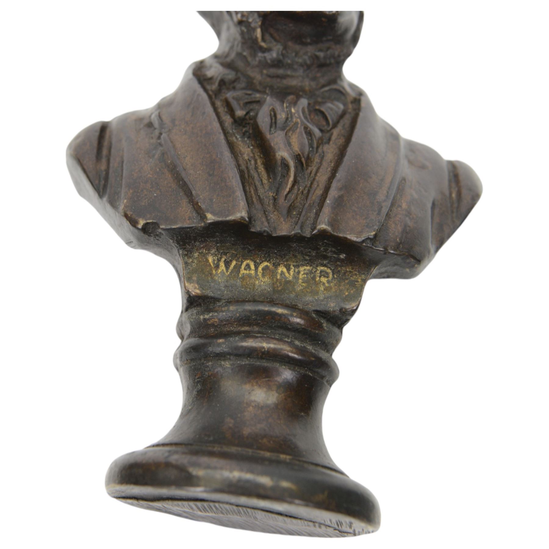 Three small bronze effect brass busts, modelled as composers Beethoven, Bach, and Wagner, each titled and raised upon a socle base, H14.5cm