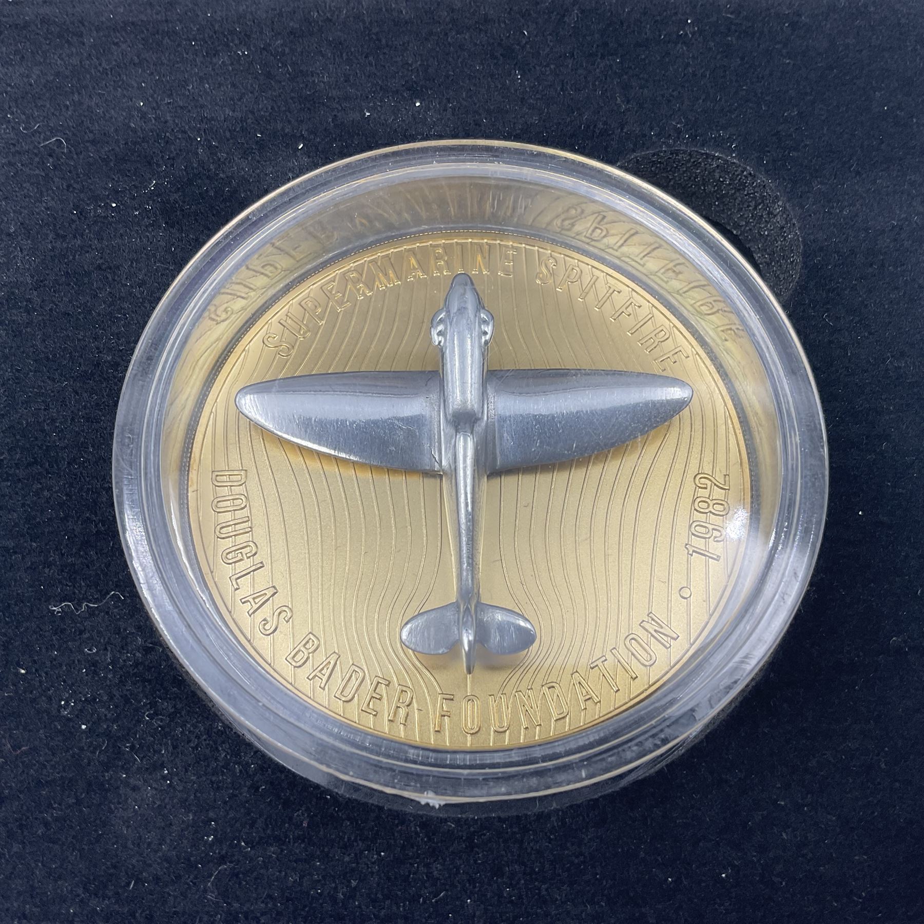 Group Captain Sir Douglas Bader gold spitfire commemorative, 9ct gold medallion mounted with a model of a Spitfire made from aluminium from AB910, gross weight 62 grams, cased with certificate