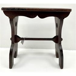 20th century hardwood vernacular joint stool, rectangular top with shaped apron, on two splayed end supports joined by pegged stretcher