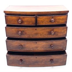 19th century bow front mahogany chest of drawers, rectangular top with moulded edge above an arrangement of two short and three long graduating drawers with turned wooden handles, raised on turned feet
