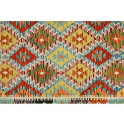 Chobi kilim with staggered diamond and stepped lozenge motifs in a palette of mustard, rust, teal, lilac and cream, the design enclosed by patterned guard stripes
