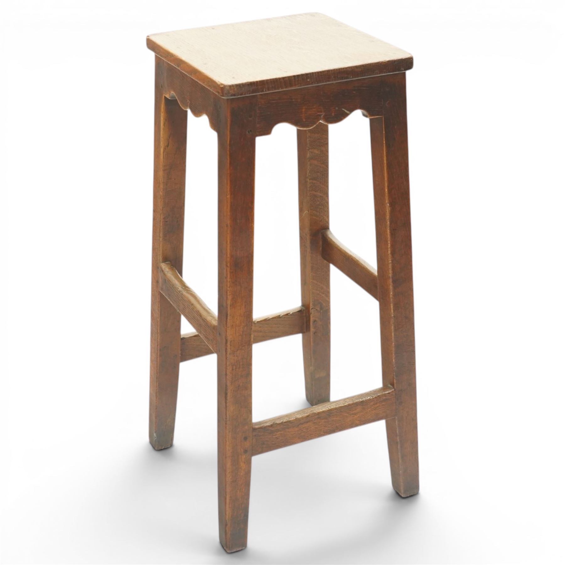 Mouseman - circa 1940/50's oak bar stool, dished square top with shaped apron, raised on four tapering square legs, joined by rails, with carved mouse signature, by Robert Thompson of Kilburn, initialled with provenance from the Old Hall, Thornton-le-Dale, North Yorkshire, further info to follow
