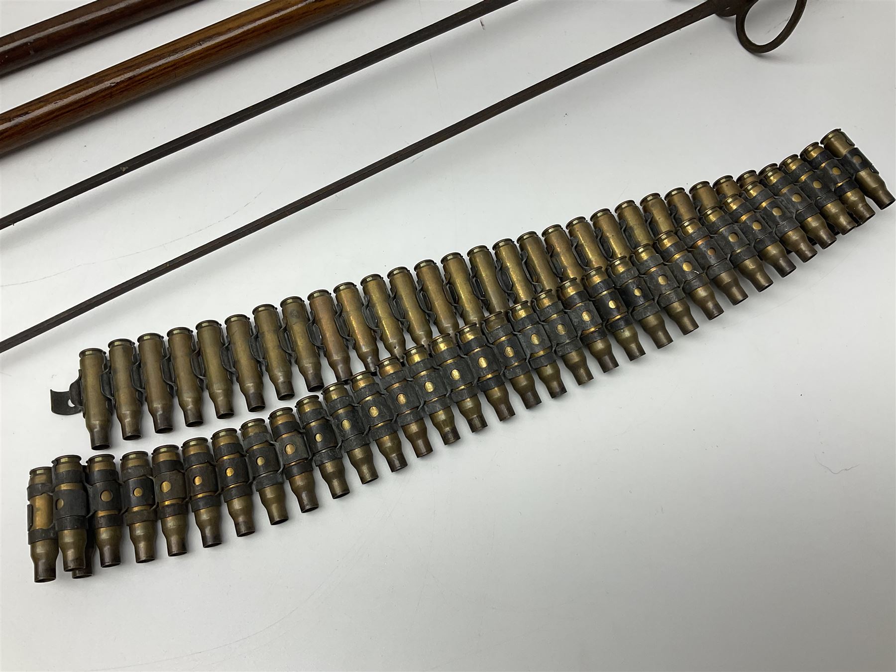 Leather covered swagger/sword stick with 40cm steel blade L62cm overall; another ash sword stick with 30cm diamond section steel blade; pair of fencing foils, the blades marked Solingen; two reproduction flintlock pistols; and 92cm inert cartridge belt (7)