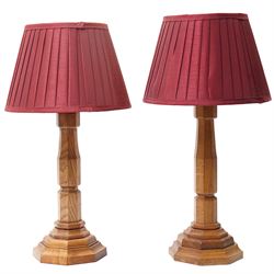 Near pair of Yorkshire oak table lamps of panel sided design on stepped hexagonal bases, t...