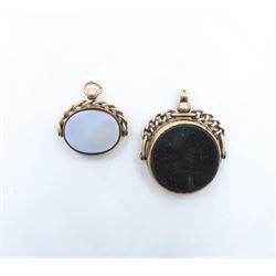  Two hardstone swivel fobs, gold mounted stamped 10ct and hallmarked 9ct, 3cm and 2.5cm diameter   