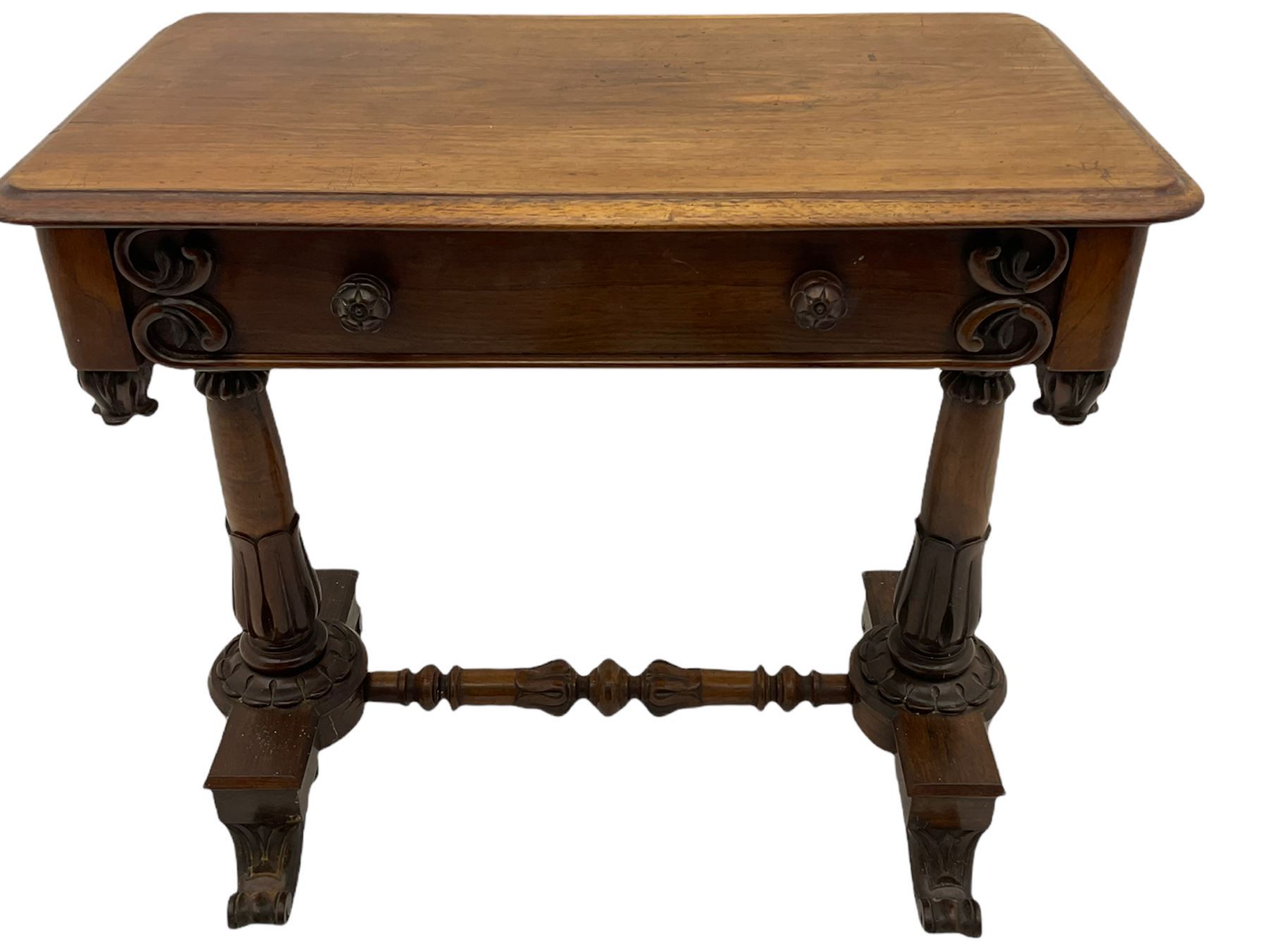 Victorian rosewood stretcher table, moulded rectangular top with rounded corners over single drawer, turned and carved twin pillar supports on platforms joined by turned stretcher, scroll carved feet