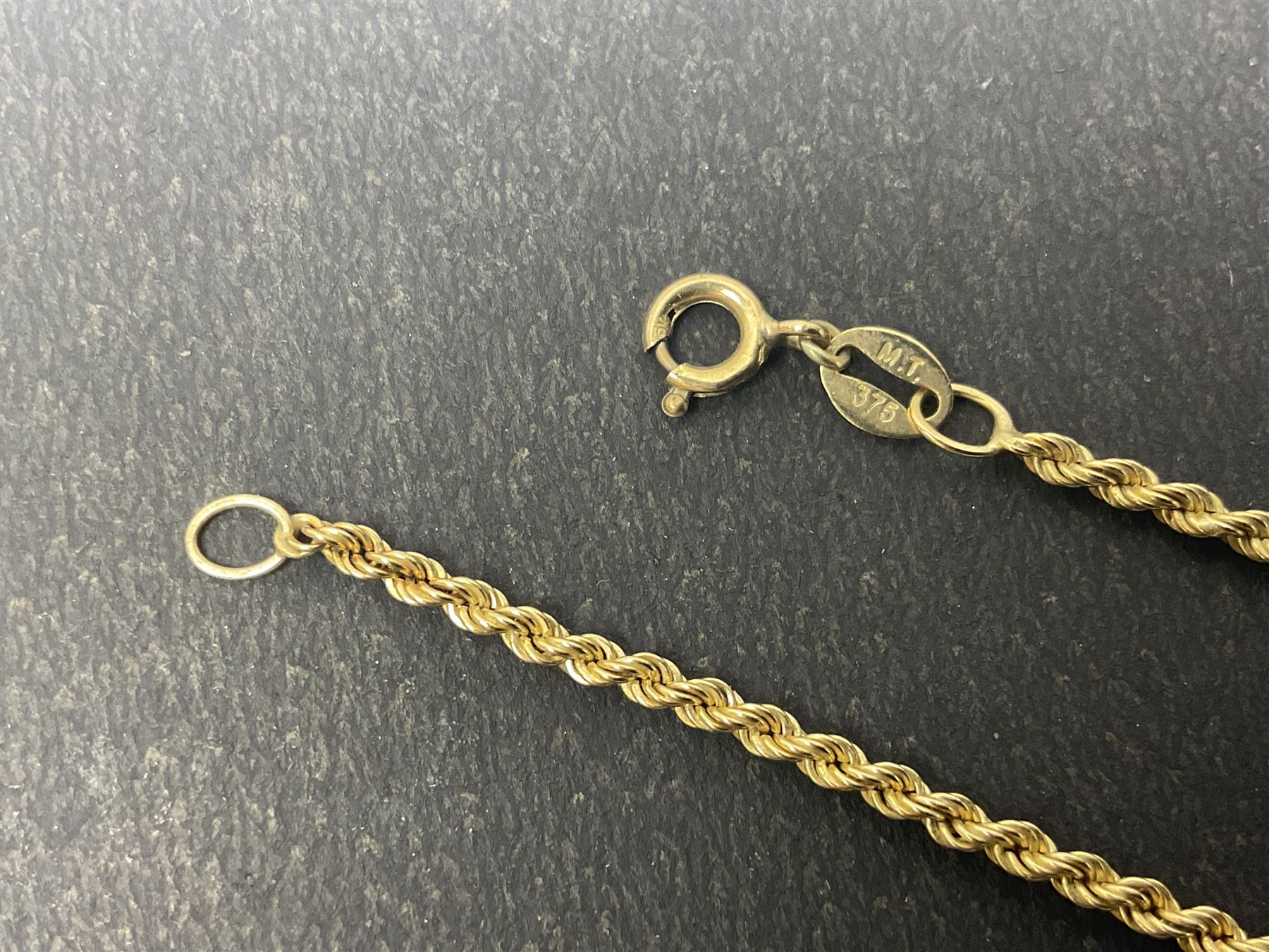 9ct gold jewellery, including opal ring and two other stone set rings, locket and rope twist chain 