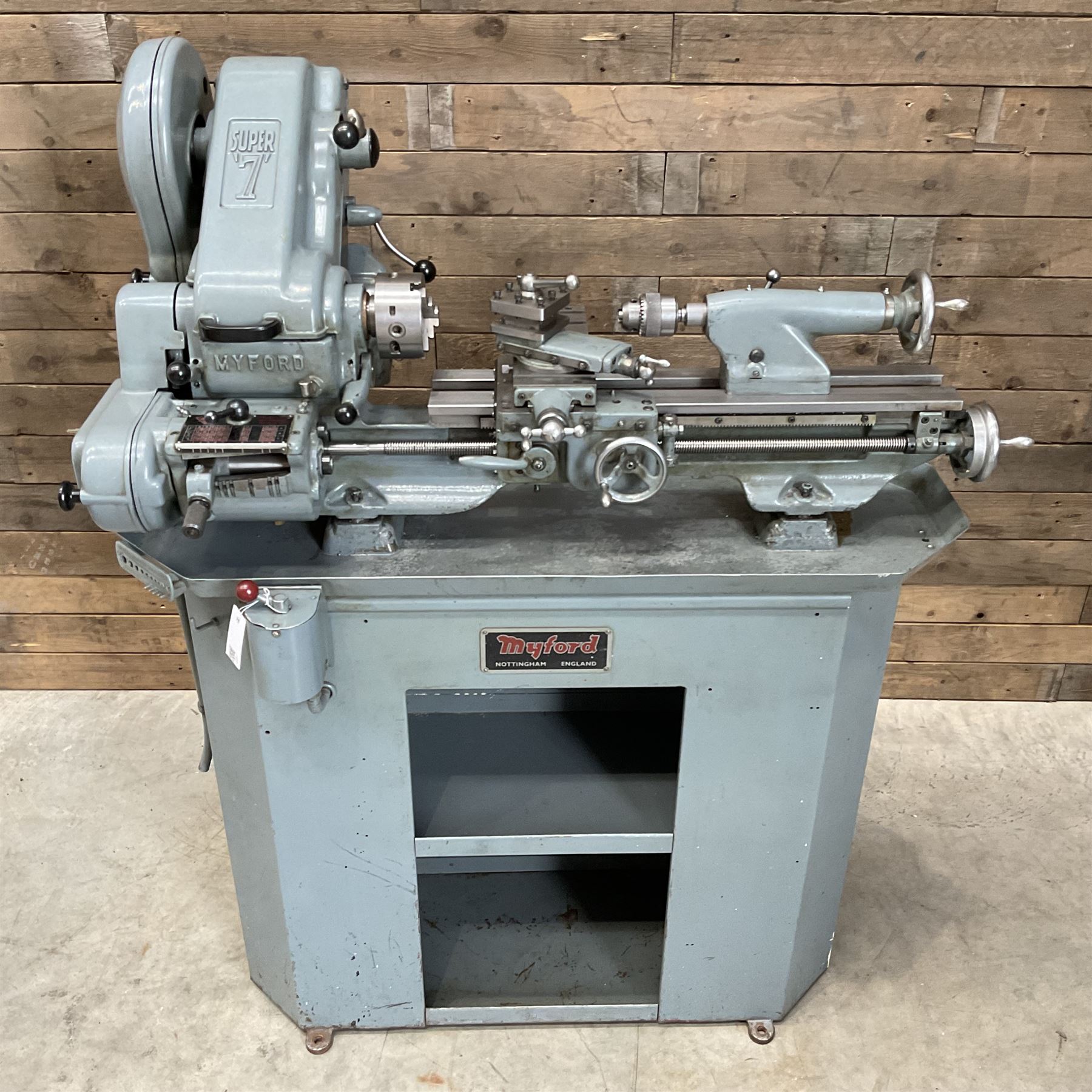 Myford Super 7 metal turning lathe with extensive collection of attachments, chucks, collets, bits; and precision metal saw