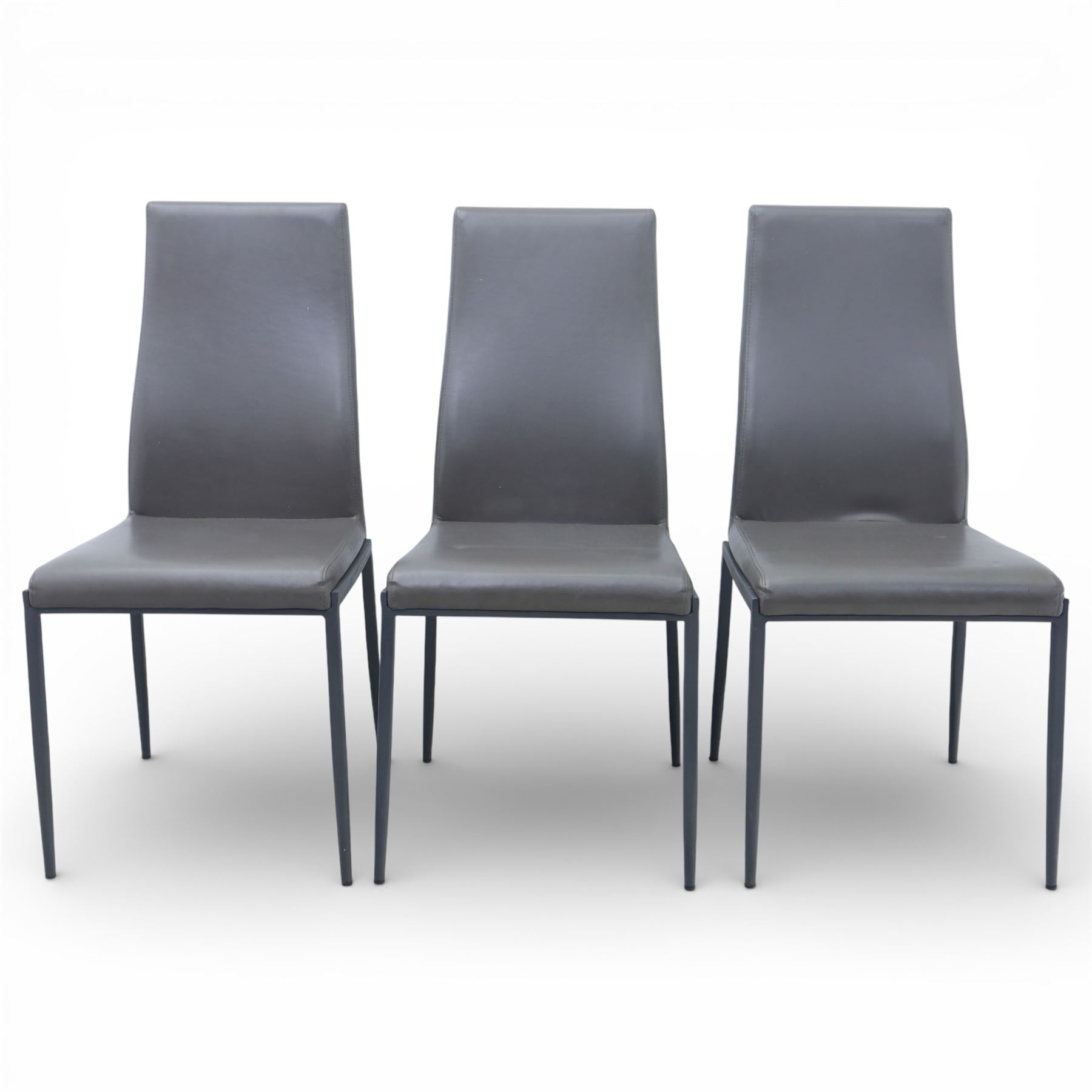 Modern composite marble effect dining table, rectangular top with simulated veining supported on a block pedestal base, accompanied by six matching dining chairs with padded seats and backs in grey upholstery on slim metal legs