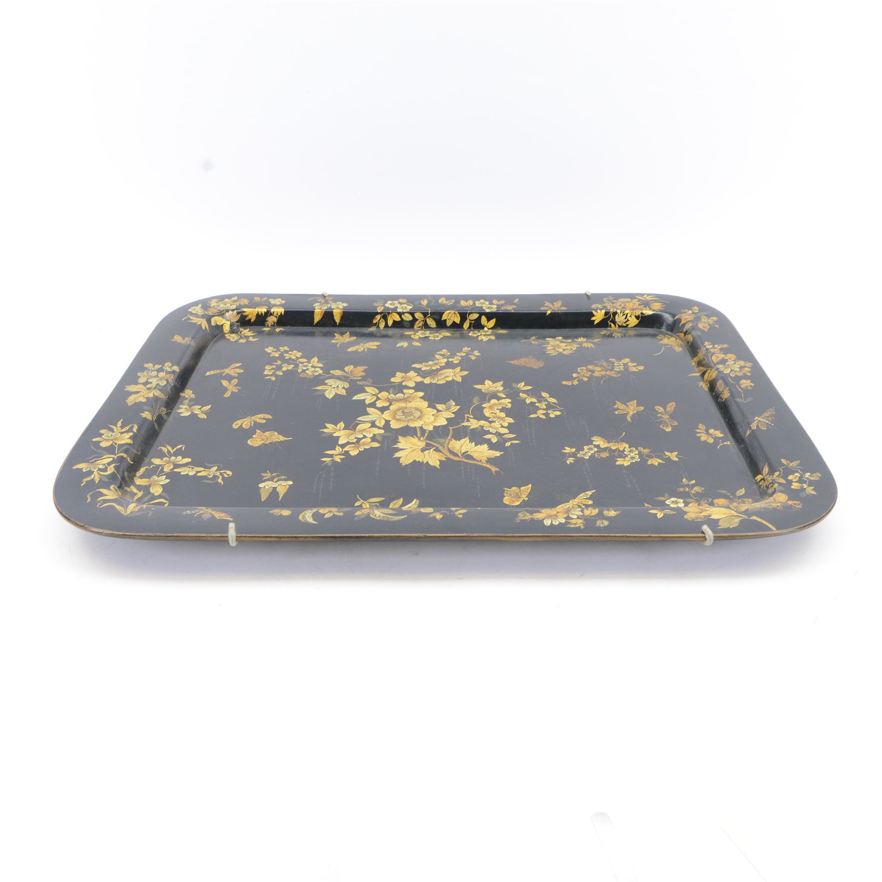 Large 19th century black lacquered papier-mâché tray, of rounded rectangular form, painted in gilt with floral sprays and butterflies, W77cm D58.5cm