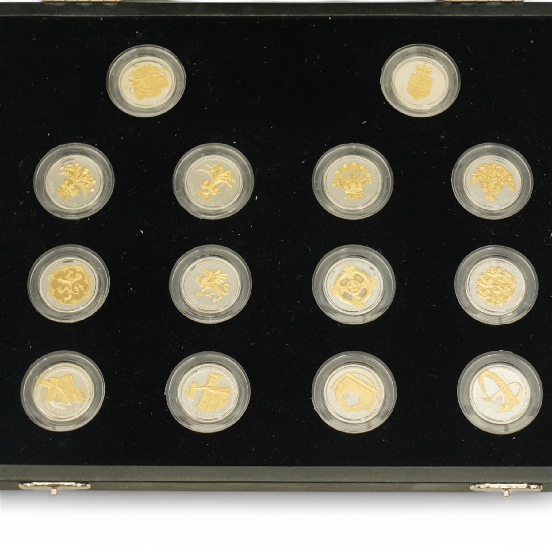 The Royal Mint United Kingdom silver proof 'One Pound Coin 25th Anniversary' fourteen coin collection, cased with certificate
