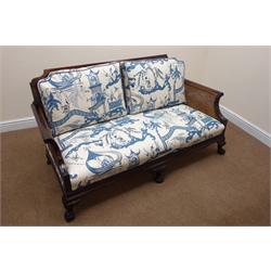 Edwardian George lll style mahogany double caned bergere sofa, moulded frame with Vitruvian scroll frieze on cabriole legs with hairy paw feet, sprung seat with loose back cushions upholstered in Sanderson Pagoda River pattern fabric, W163cm, D84cm, H78cm  