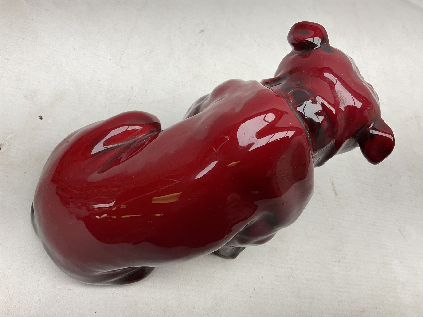 Royal Doulton Flambe figure of a Bulldog, modelled seated, model no 135, with printed maker's mark and K and impressed 135 beneath, H13.5cm