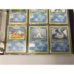 Collection of Pokemon trading cards, mostly 1999 Wizards Pokemon cards to include holo Charizard 4/102, first edition holo Machamp 8/102, further holographic cards; Dark Flareon 35/82 and Dark Vaporeon 45/82, cards from themed sets and 4th edition prints; 1998 Electronic Pokédex with cardboard boxes for themed decks Blackout, Overgrowth and Power Reserve Jungle, along with a large quantity of energy and trainer cards 