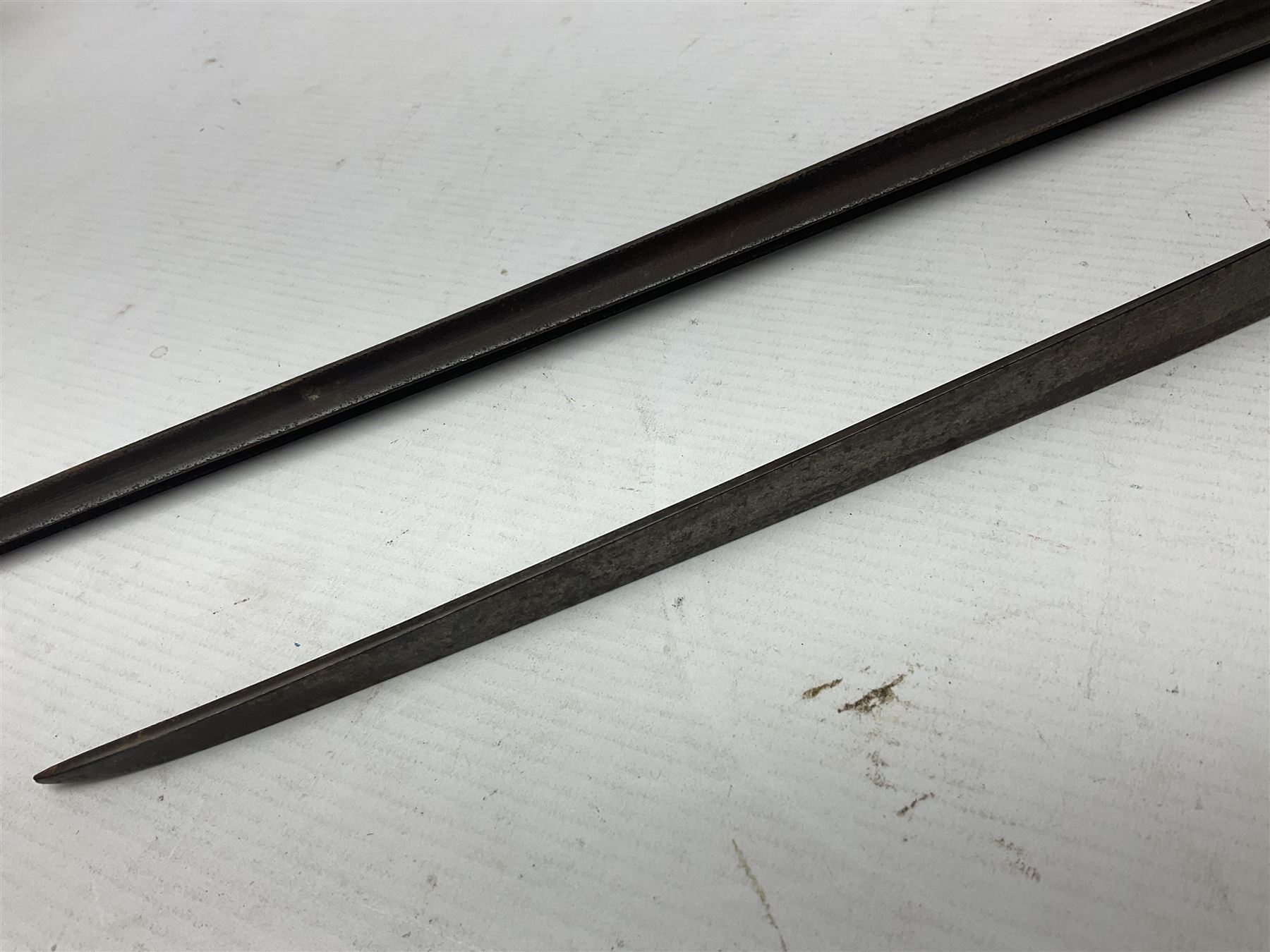 Early 19th century British Brown Bess musket rifle socket bayonet with zigzag fitting stamped D71 and triangular blade stamped 270 L55cm overall; and two other 19th century socket bayonets; no scabbards (3)