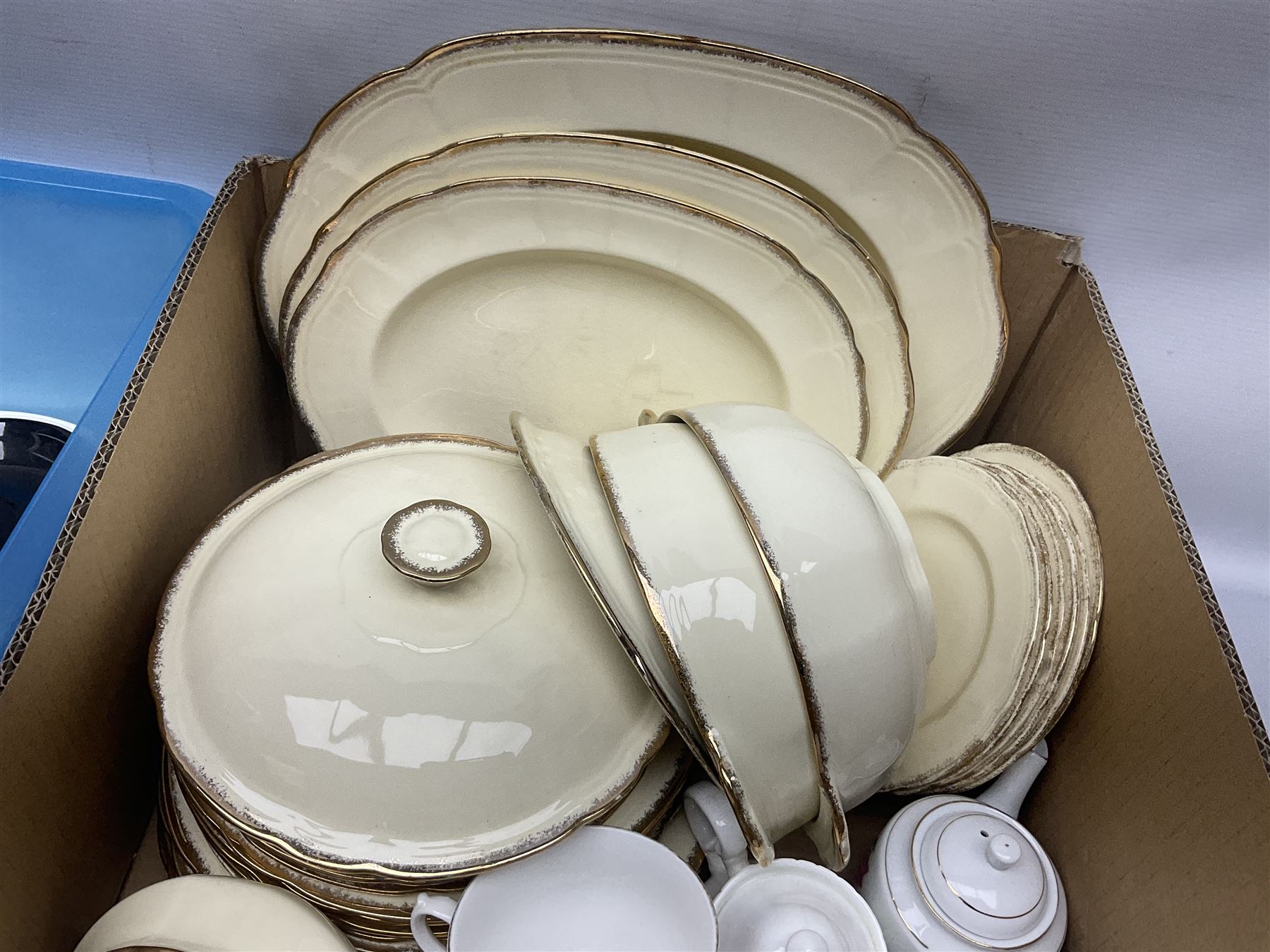 Royal Albert Masquerade pattern tea service for six, together with Royal Albert Dogwood pattern teacup and saucer and Alfred Meakin tea and dinner wares decorated with gilt on cream ground to include lidded tureens and oval serving plates etc in two boxes