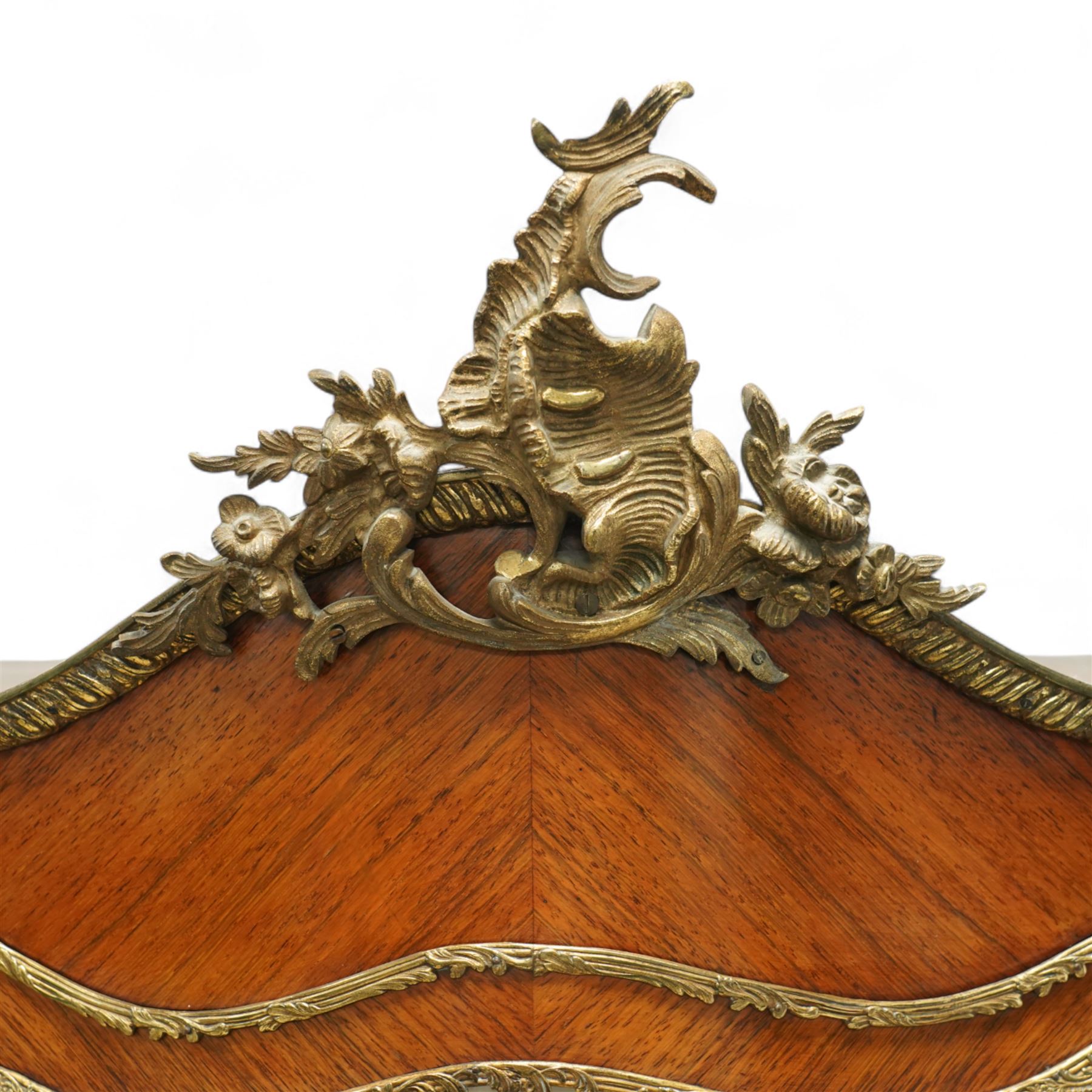 Louis XV revival kingwood Vernis-Martin serpentine fronted vitrine cabinet, arched top with gilt brass foliate mounts, glazed door with two shelves above three painted panels, depicting pastoral scenes, supported on out-swept cabriole legs with gilt brass mounts and sabots.