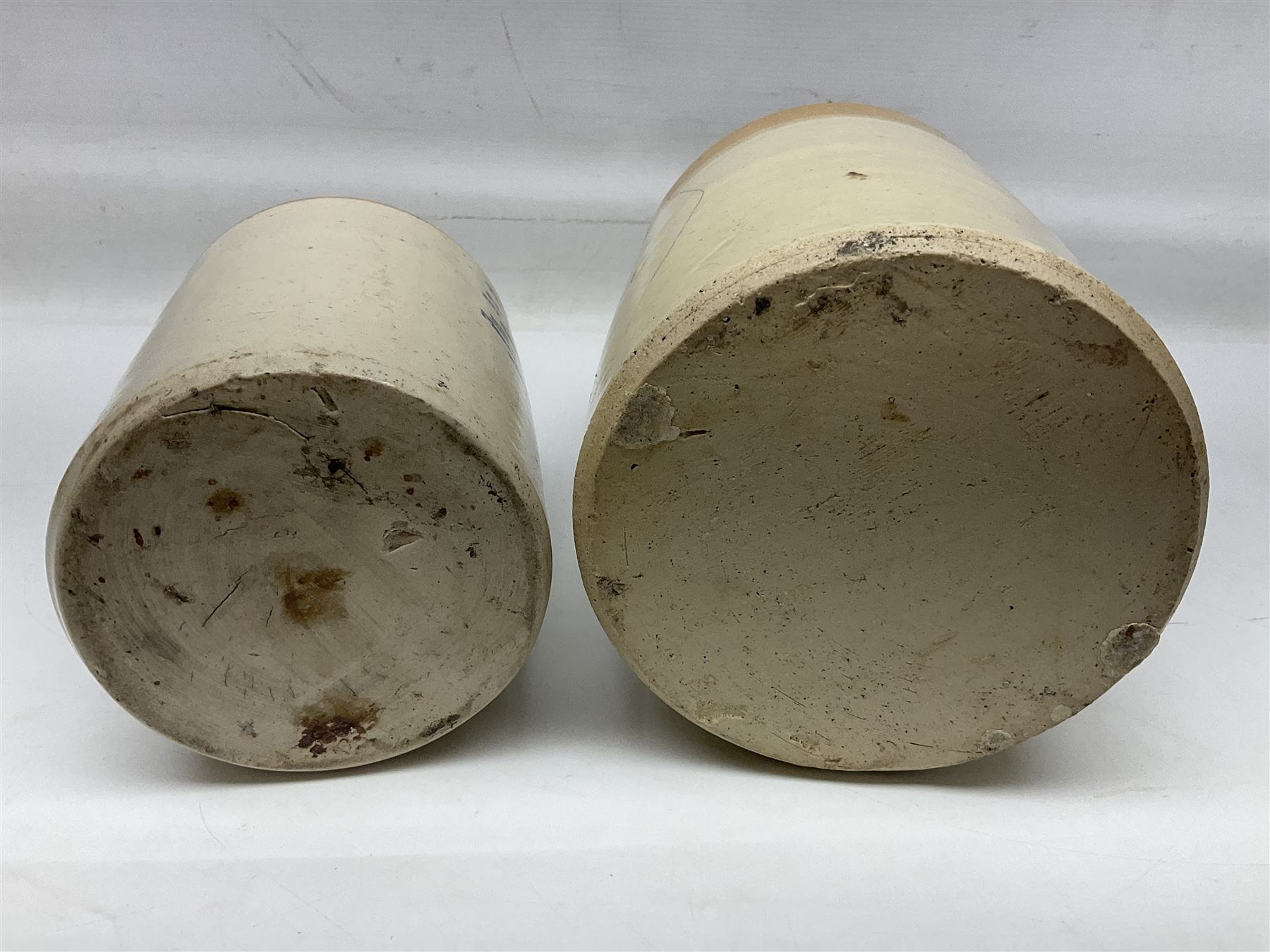 Early 20th century stoneware advertising flagon, marked to front 'Pickup Bros Botanical Brewers', together with a larger stoneware flagon