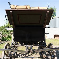 The Zetland Body Break by Peters & Sons, London

A fine and substantial late nineteenth century body break by Peters & Sons of London, circa 1880, formerly owned by the Marquis of Zetland. The carriage is finished in dark olive green and black with red, black and yellow lining, and is fitted with an elevated coachman’s box seat above a forward luggage compartment. The open rear body is entered by side doors and arranged with opposing longitudinal passenger seating.

The carriage is mounted on English pattern wooden artillery wheels with iron tyres and is carried on full elliptic springs, with a transverse helper spring behind. The front axle is fitted with fifth wheel turntable steering. The rear passenger compartment has upholstered longitudinal side benches beneath padded back rails, with turned spindle upper panels to the side doors and rear handrails. The driver’s seat is upholstered in corded fabric and secured with leather retaining straps.

Details include shaped splinter bar and turntable, folding rear step below the door with leather covered interior handle, luggage rails to either side, pole fittings for use with a pair or team of horses, and a handbrake with brake blocks operating to both rear wheels. The wheel hubs are fitted with polished hub caps engraved “Peters & Sons, London”. The exterior retains small Zetland family crests to the side panels.

The carriage has been conserved by Woods of Fairbourne Carriages Ltd and is recorded as Lot 146 in The George Shaw Collection sale, 5 November 2003, where it was catalogued as The Zetland Body Break and described as having previously been owned by the Marquis of Zetland.

Features
• Peters & Sons, London coachbuilder’s hub caps
• Known as The Zetland Body Break
• Formerly owned by the Marquis of Zetland
• Circa 1880
• Conserved by Woods of Fairbourne Carriages
• Dark olive green and black bodywork with red, black and yellow lining
• Elevated coachman’s box seat
• Forward luggage compartment
• Open rear passenger body with side doors
• Opposing longitudinal passenger seating
• Turned spindle upper panels to the side doors
• Folding rear step with leather covered interior handle
• Full elliptic spring suspension with transverse helper spring behind
• Fifth wheel turntable steering
• Handbrake with brake blocks operating to both rear wheels
• Wooden artillery pattern wheels with iron tyres
• Shaped splinter bar and pole fittings for a pair or team of horses
• Small Zetland family crests to the side panels

Provenance
The George Shaw Collection, 5 November 2003, Lot 146. Previously owned by the Marquis of Zetland.

Conservation

Conserved by Woods of Fairbourne Carriages.

Dimensions:
Overall length: 310 cm
Width: 176 cm
Height: 226 cm

Front wheel diameter: 98 cm
Rear wheel diameter: 140 cm

Seating:
Driver's box seat: 2 persons

Rear passenger compartment: Two longitudinal benches accommodating approximately 8 to 10 passengers