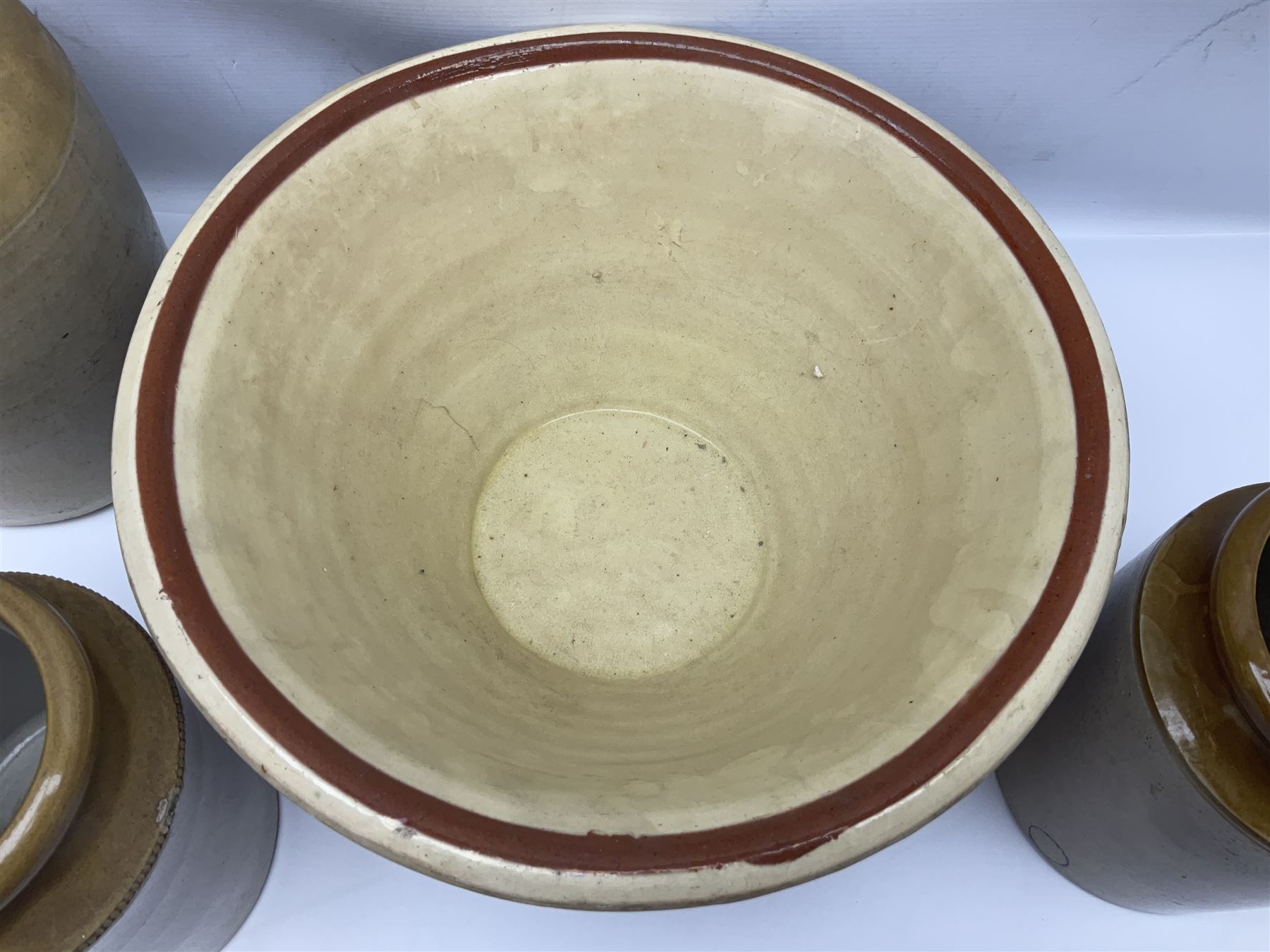 Terracotta bread proving bowl, together with three stoneware jars, tallest H26.5cm