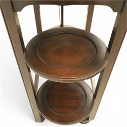 Early 20th century side table with double cake stand, rectangular moulded top, cake stands either side with support, raised on square legs terminating in castors