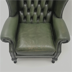  Queen Anne style wingback armchair upholstered in deep buttoned green leather, cabriole legs, W82cm  