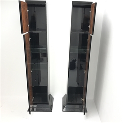 Pair Art Deco style figured walnut and ebonised tall narrow cabinets, interiors fitted with adjustable glass shelves, applied gilt geometric shapes to doors, on stepped chamfered bases, W45cm (base), H186cm, D42cm (base)  