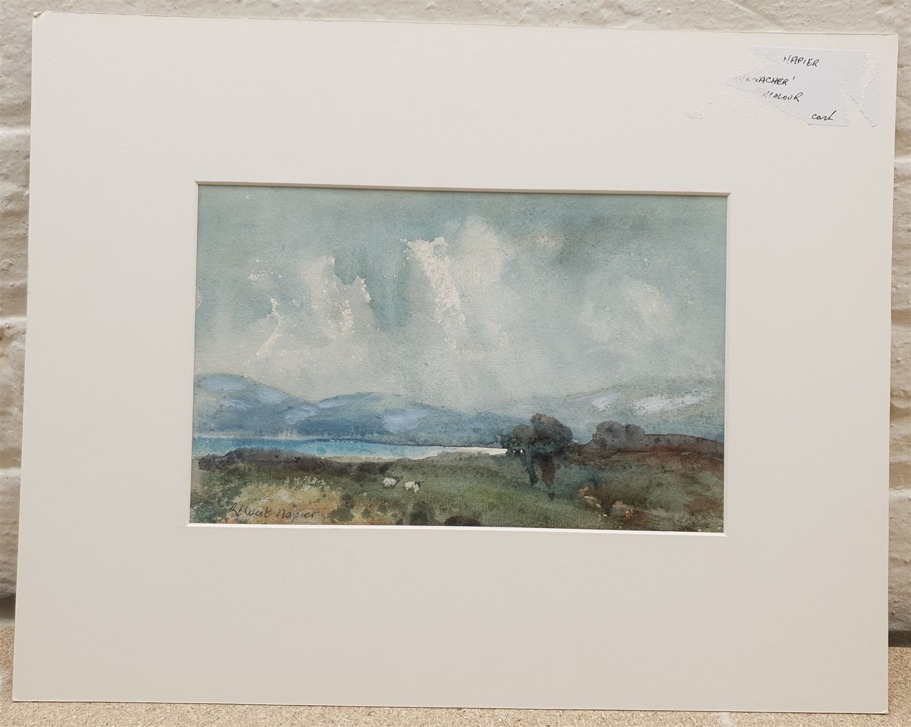 Robert West Napier (Scottish 1876-1962): Sheep Beside a Loch, watercolour signed 16cm x 25cm (mounted)