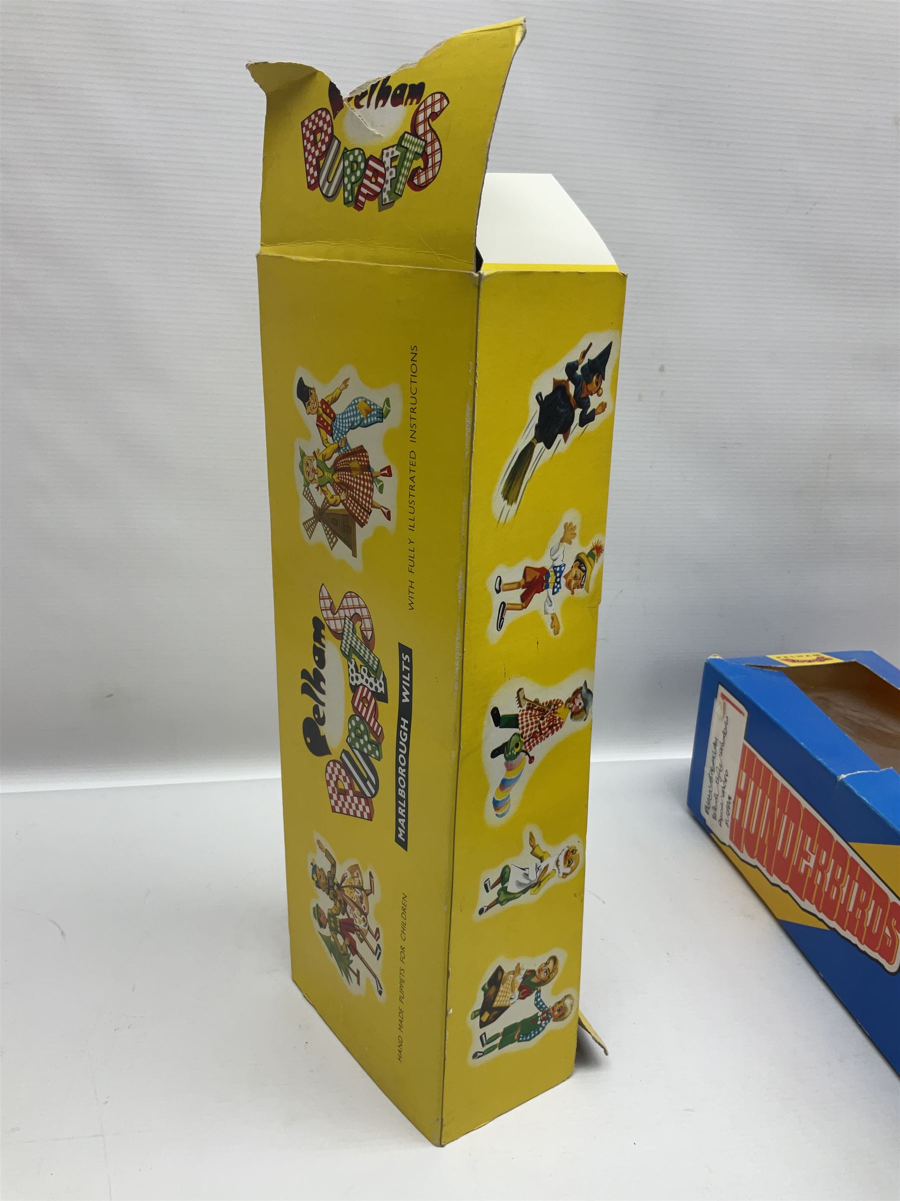 Three Pelham puppets - 'Brains' from Thunderbirds in blue/yellow box; Witch in yellow window box; and Macboozle in brown box (3)