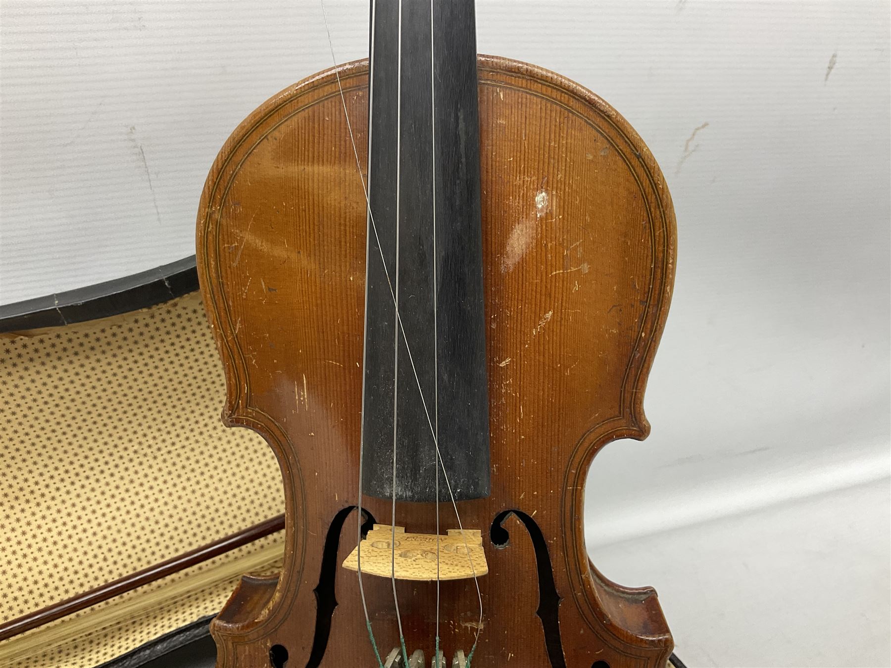 German copy of a Maggini violin c1900 with 35.5cm two-piece maple back and ribs and spruce top, bears label 'Maggini Deutsche Arbeit 1866' L59cm; in carrying case with bow