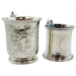 Two Victorian silver Christening mugs, the first example with acanthus scroll handle and engraved monograms to the body surrounded by chased foliate decoration, hallmarked Edward & John Barnard, London 1854, H9.5cm, the second of slightly waisted form with beaded scroll handle and engraved monogram to body, hallmarked Gough & Silvester, Birmingham 1867, H7.5cm, approximate total weight 7.18 ozt (223.5 grams)