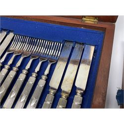 Victorian silver plated dessert set by Elkington & Co for twelve place settings, each reeded handle with vacant cartouche, each with Elkington & Co mark, date letter for 1861, and registration lozenge, contained within a mahogany case with vacant brass cartouche to the hinged cover, opening to reveal a Royal blue baize lined interior with removable tray, case H6cm W29.5cm D26.5cm