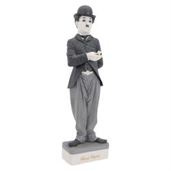 Two Spanish Algora Personajes Del Cine figures, modelled as Charlie Chaplin and Groucho Marx, with printed marks beneath, both with certificates of authenticity, H35cm