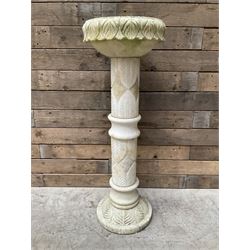 Marble bird bath with carved leaf decoration