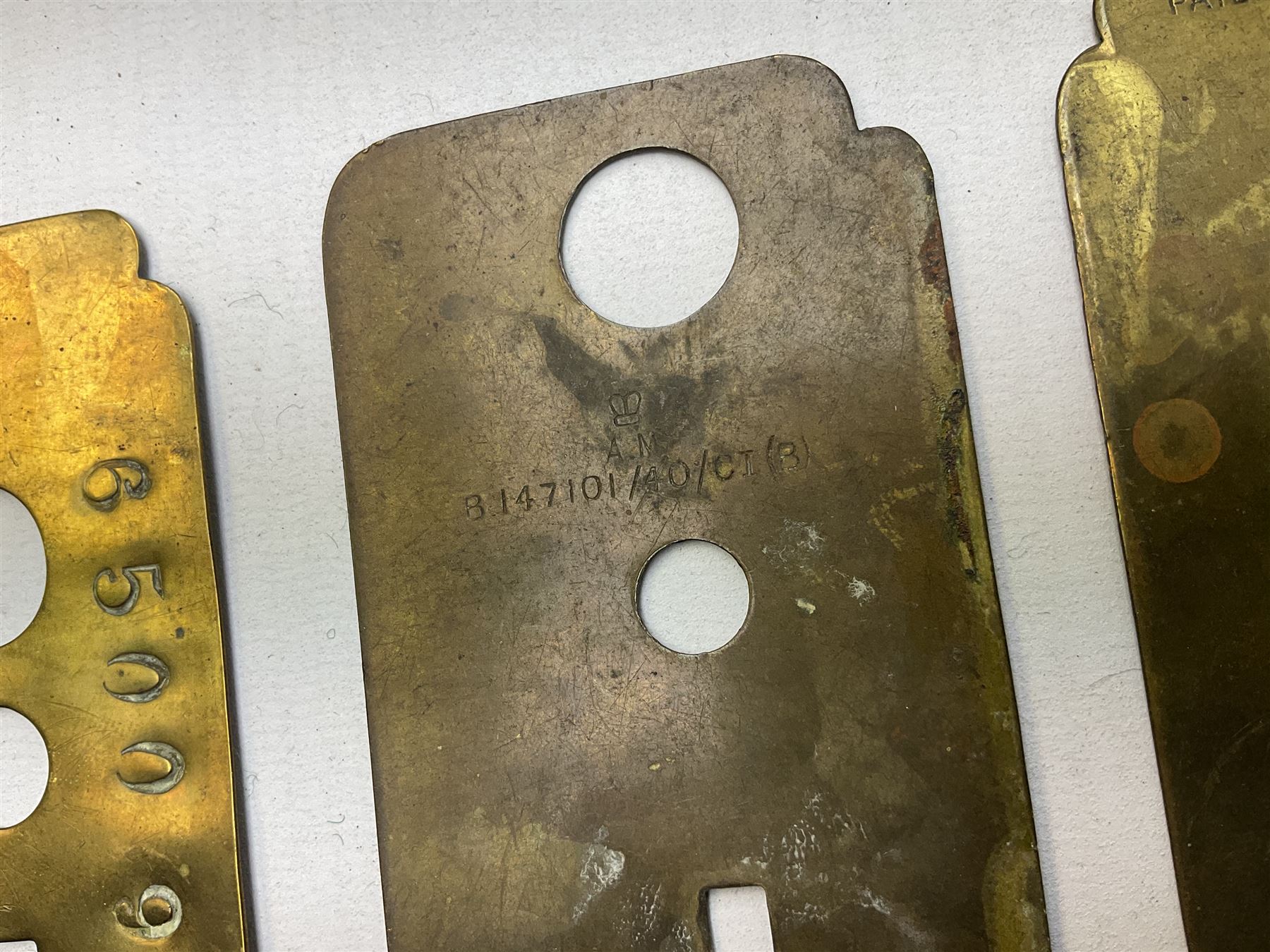 Three war department brass uniform protector button polisher, one marked 650097