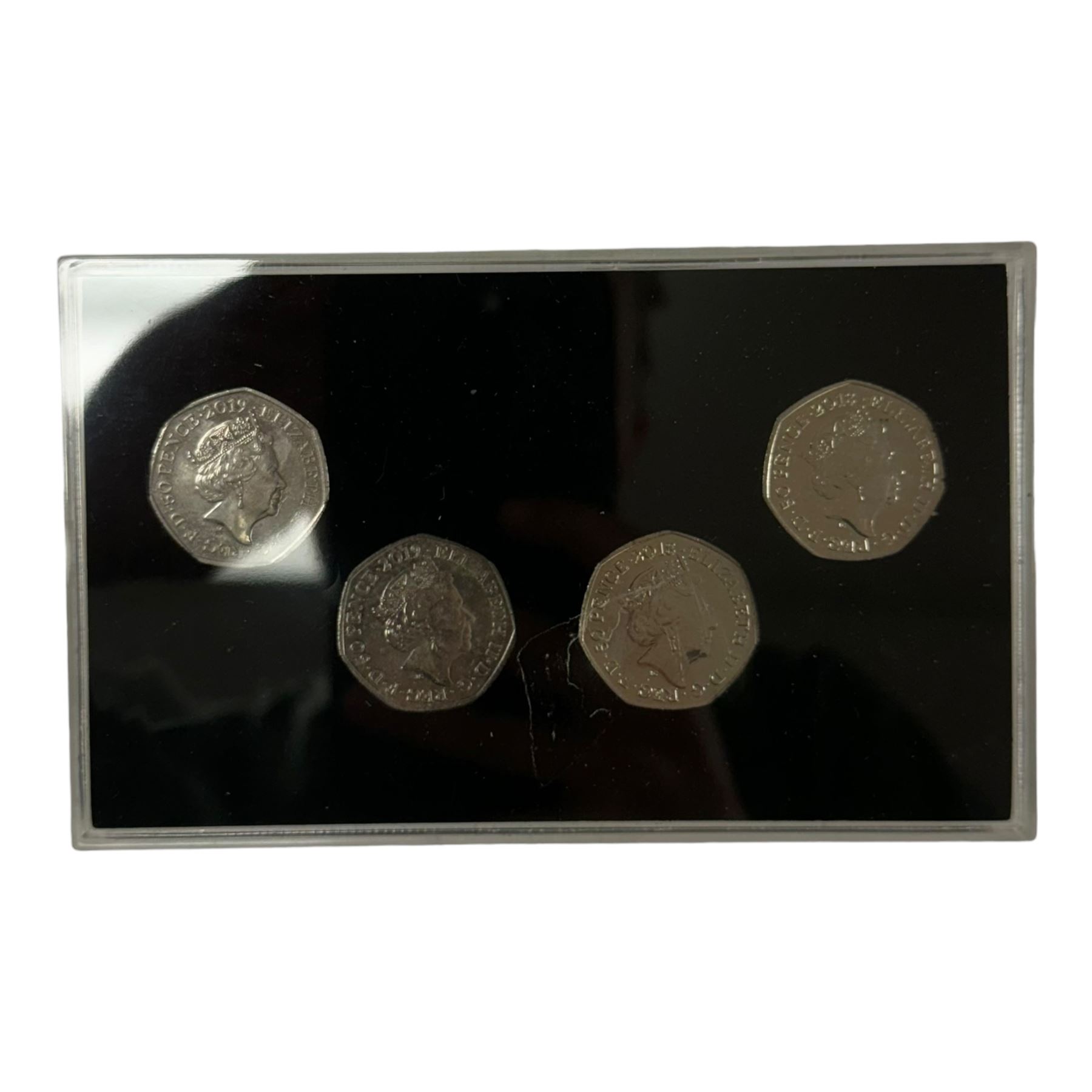 Mostly commemorative coins, medallions and fantasy coinage, including various 'Sainsbury's Makers of the Millennium' medal collection folders containing various medallions, The Toer Mint commemorative four medallion set in fitted case, Queen Elizabeth II 1982 silver proof piedfort twenty pence coin cased with certificate, various part filled The London Mint office folders etc