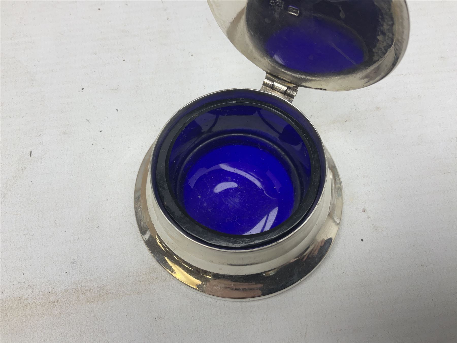 Early 20th century silver mustard pot and cover, with blue glass liner, hallmarked Hawksworth, Eyre & Co Ltd, Sheffield 1911, approximate silver weight 59.4 grams
