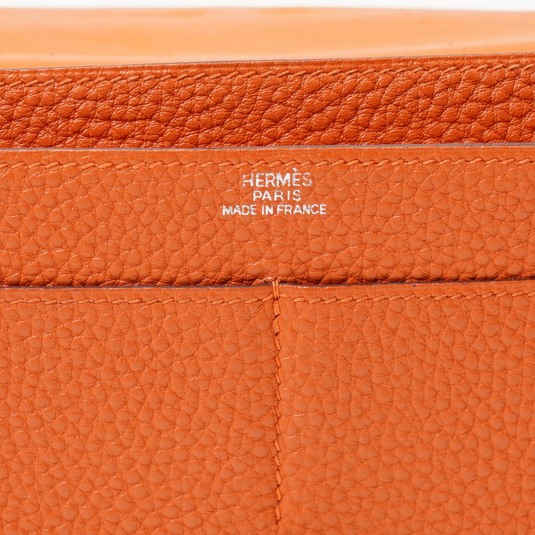 Hermès - Dogon Duo wallet, orange Togo leather, with palladium-plated Clou de Selle fastening, detachable zipped coin purse and fitted interior, stamped 10N H, with original box