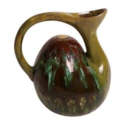 Dr Christopher Dresser - Linthorpe pottery hump back water jug with incised and green glazed decoration and loop handle, facsimile signature and numbered 347 H17cm