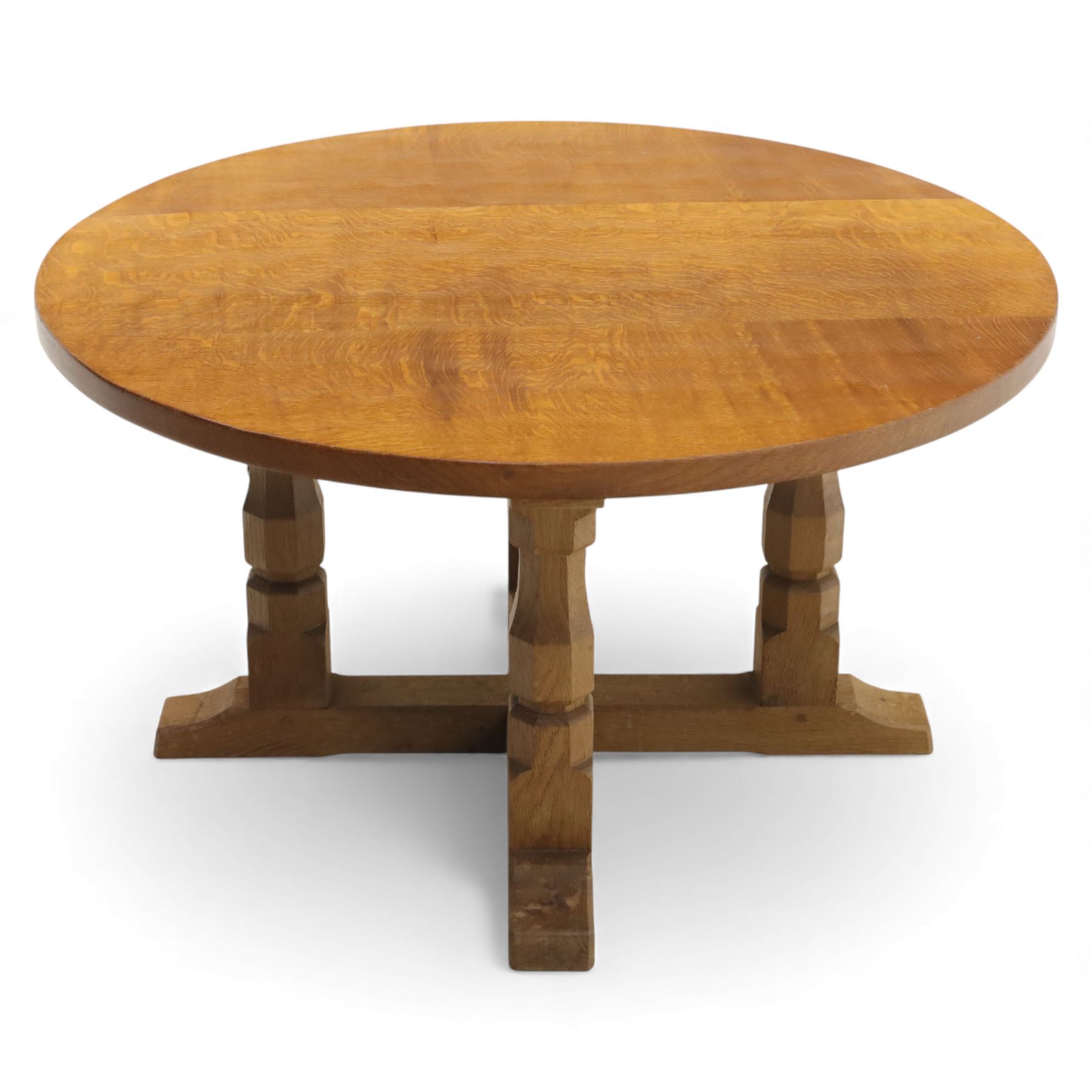 Mouseman - oak coffee table, the circular adzd top over four pillars united by stretchers, with signature mouse carving by Robert Thompson of Kilburn 