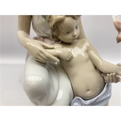 Lladro figure, Where Love Begins, modelled as a mother of child feeding birds, numbered beneath 7649, H33cm