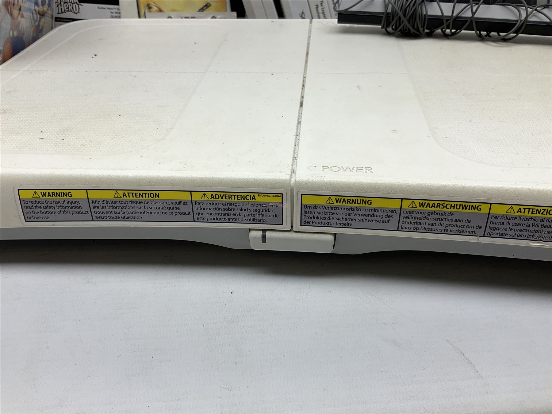 Nintendo Wii console, four controllers with cases and four nunchucks, Wii sensor bar, balance board and dance mat. Guitar hero wireless guitar for Wii and Redoctane wired guitar. Nintendo DS lite handheld gaming console, console and game cases and Guitar Hero Redoctane Guitar Grip. Selection of Nintendo Wii and Nintendo DS lite games to include Super Mario Galaxy, Guitar Hero, Wii Fit, Legend of Zelda games etc. Archos AV400 Series pocket video recorder with accessories, cradle and remote, in three boxes