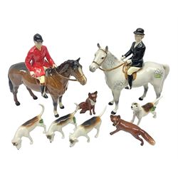 Beswick hunting group, comprising huntswoman on dappled grey horse no 1730, huntsman on bay horse no 1501, two fox figures no 1440 and 1748, and four fox hounds, all with printed marks beneath (8)
