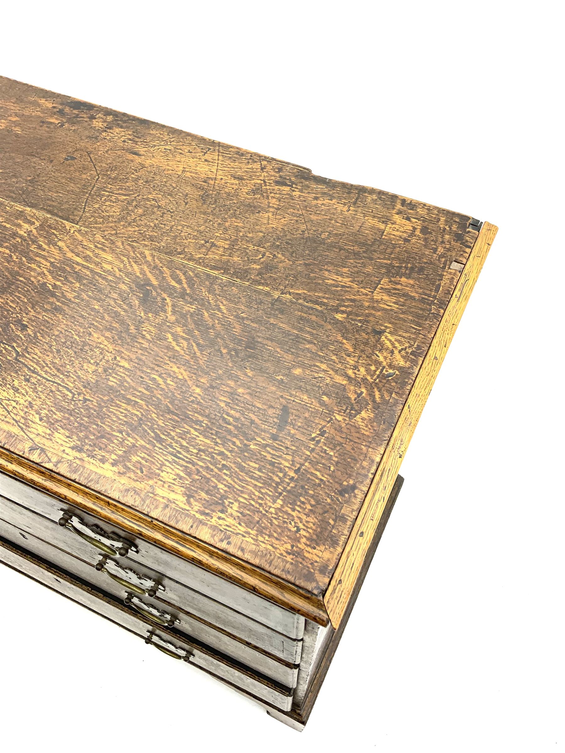 George III oak chest fitted with two short and three long drawers, corassbanded top