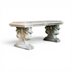 Ornate weathered cast stone rectangular garden bench, raised on winged griffin supports, s...