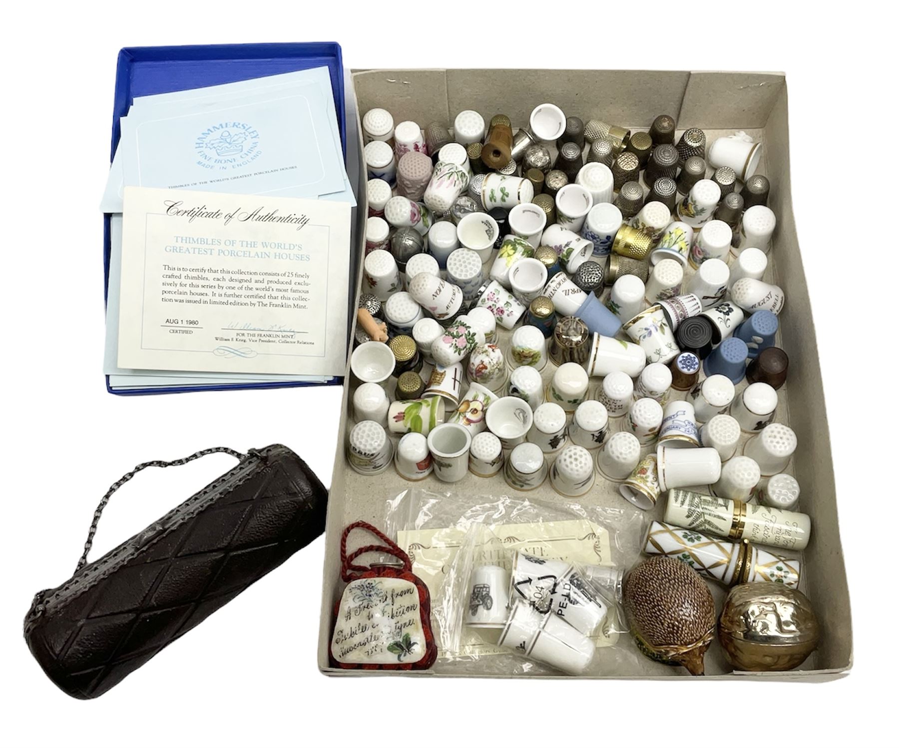 Large collection of thimbles, to include Wedgwood jasperware examples, Spode, cloisonné, together with tape measure in the for of a walnut, hedgehog thimble case etc