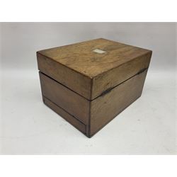 Walnut dressing table box, set with mother of pearl cartouche, opening to reveal a compartmentalised interior with mirror, covered in parts in purple velvet, together with a smaller jewellery box with stencil print, dressing table box H15cm